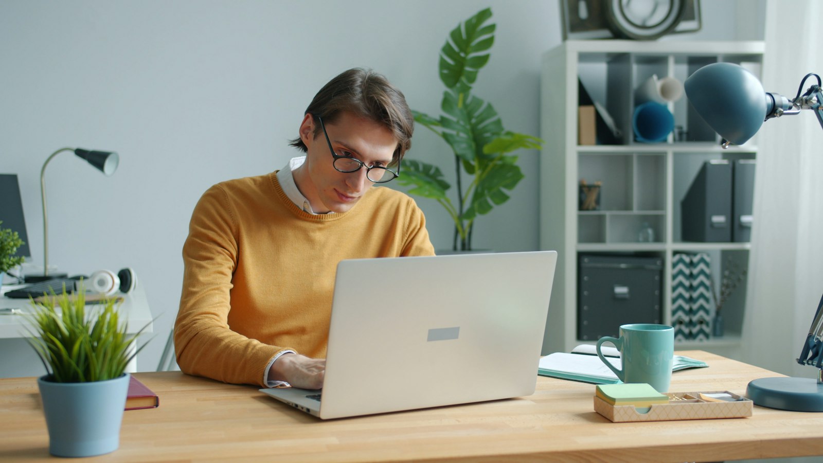 An engineer reviewing work at a laptop